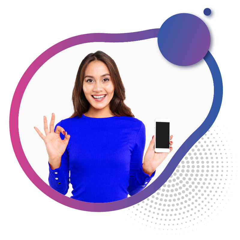 Smiling woman in blue holding a smartphone and making an OK hand gesture, representing reliable mobile connectivity.